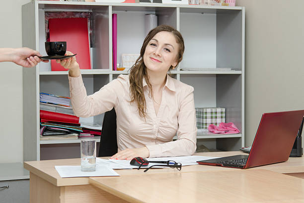 istock Director shall make a cup of tea with the Secretary 505873565