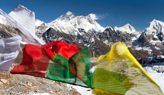 view of Mount Everest, Lhotse and Makalu with buddhist prayer flags from Renjo La pass - Nepal
