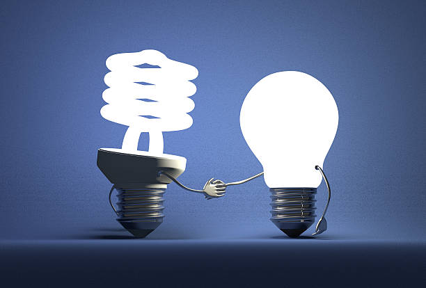 istock Glowing spiral light bulb character and tungsten one handshaking 505886229