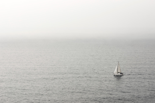 lonely sailboat on the water