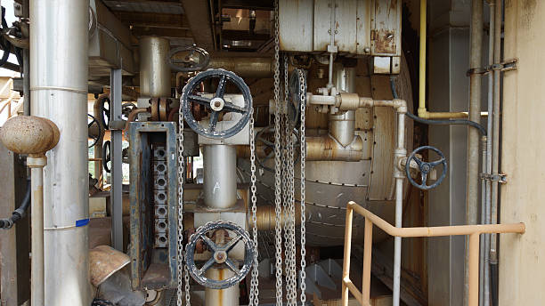 istock Wheels with pulleys and chains in a industrial site plant. 505887002