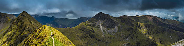 Epic mountain landscape peak panorama Ring of Steall Highlands Scotland The dramatic spine of Devil's Ridge in the Mamores around the Ring of Steall to Am Bodach and Stob Ban deep in the idyllic Highland mountains of Lochaber, Scotland. ProPhoto RGB profile for maximum color fidelity and gamut. fort william stock pictures, royalty-free photos & images