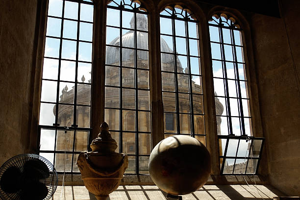 The Radcliffe Camera in Oxford, England The Radcliffe Camera in Oxford as seen from a window of the Bodleian Library. radcliffe camera stock pictures, royalty-free photos & images