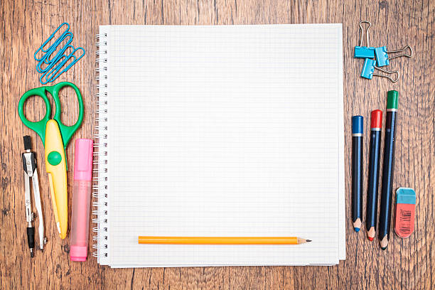 istock School accessories and blank notebook on a desk 505888153