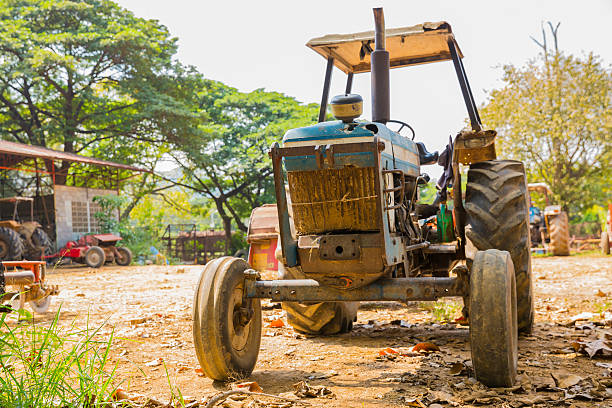 istock Very old tractor in field 505888618