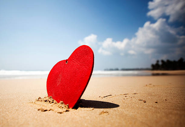istock red heart on exotic sandy beach - Valentine's day concept 505888710