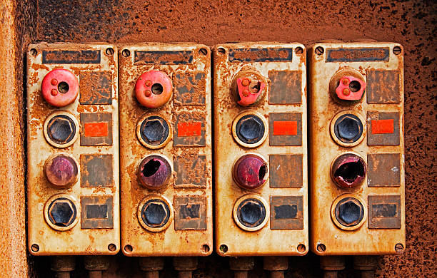 old electric interruptores on rusty plancha de pared - remote control close up selector gray fotografías e imágenes de stock