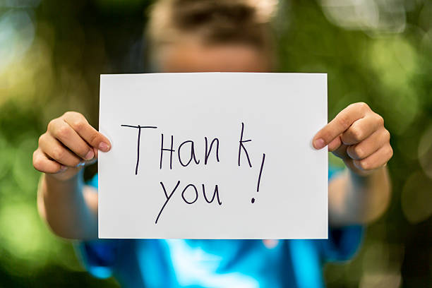 Boy with Thank You sign stock photo