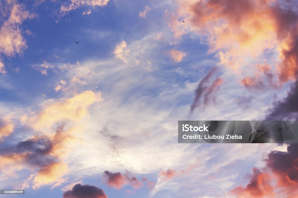 Sunset sky with clouds Colourful sunset sky with fluffy clouds Awe Stock Photo