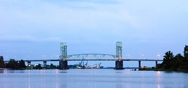 Cape Fear Bridge A view of the Cape Fear Bridge from the River Walk in Wilmington NC cape fear stock pictures, royalty-free photos & images