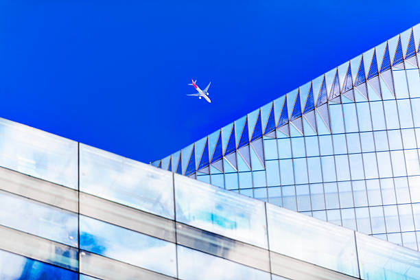 istock airplane and office building 505890339
