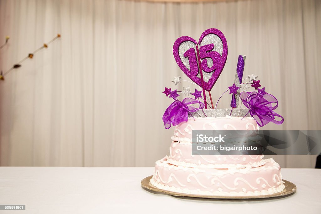 Fifteen years birthday party cake, pink and white. 15 years birthday party cake, pink and white. Candles and heart. Celebration. 14-15 Years Stock Photo
