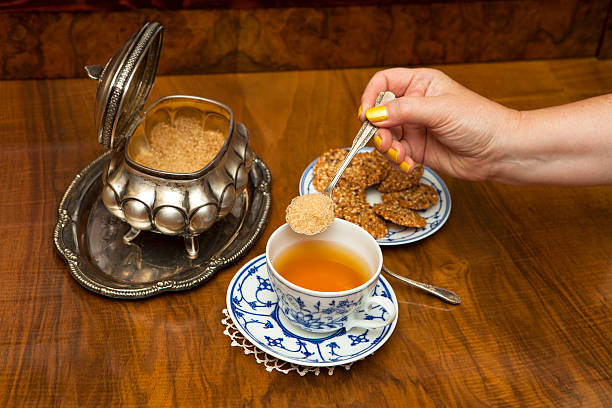 Sweetening tea with brown sugar