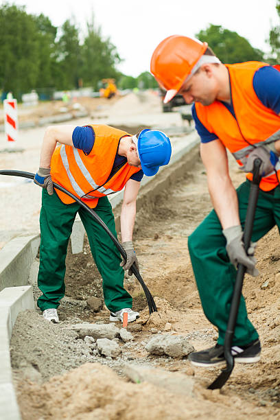 istock Physical labourers working outdoors 505892586