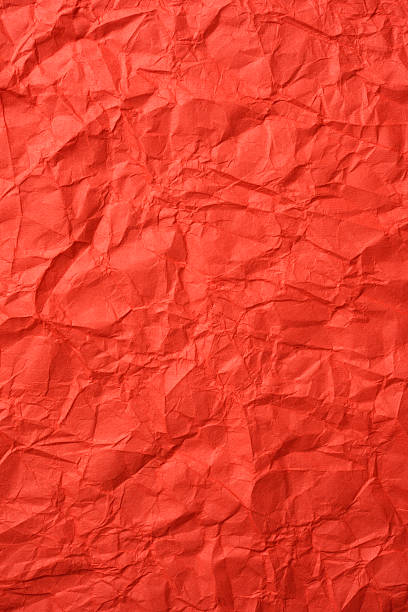 istock Crumpled orange color rice paper texture background 505892996