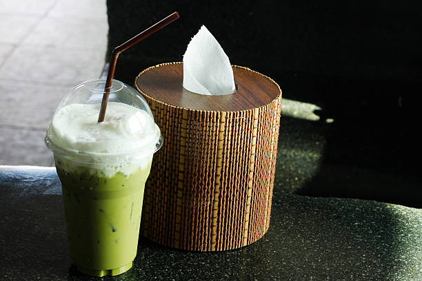 istock cool greentea with milk and box of tissues 505893032