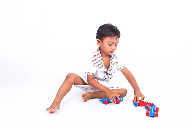 istock little asian boy play building brick 505893158