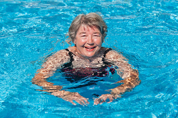 Senior Woman Swimming stock photo