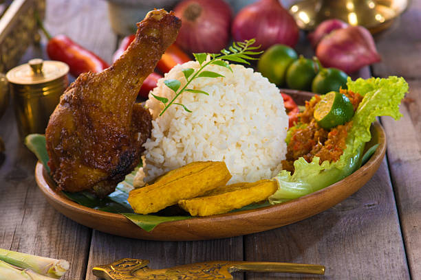 istock rice penyet chicken, indonesian fried chicken rice 505893676