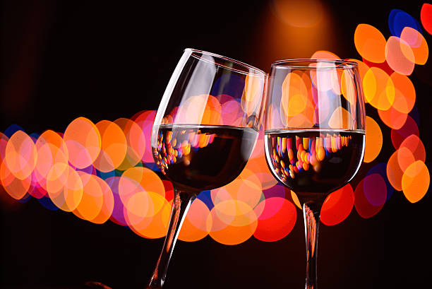 istock Two wine glasses clink at the party 505894322