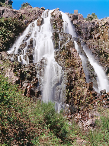 Waratah Falls is an amazing large waterfall that drops down into a gully below, Tasmania, Australia