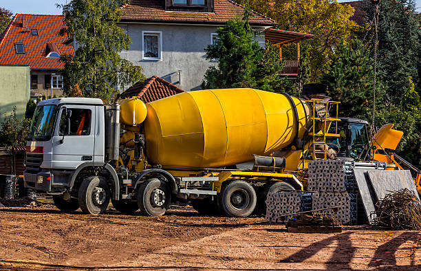 istock Concrete mixer truck in construction site 505897068