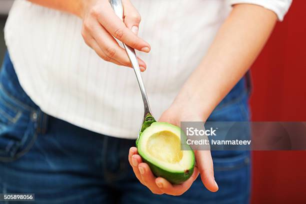 Young Woman Making Salad Stock Photo - Download Image Now - Adult, Avocado, Cooked