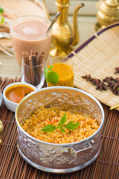 istock Indian Biryani mutton rice with traditional background 505898098