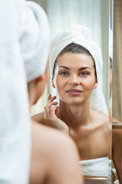 istock Woman looking at the mirror 505898646