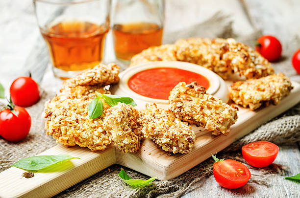 istock almond crusted chicken tenders with ketchup 505899690