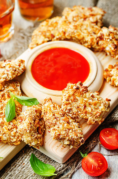 istock almond crusted chicken tenders with ketchup 505899778