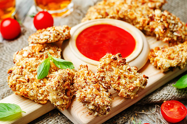 istock almond crusted chicken tenders with ketchup 505899842