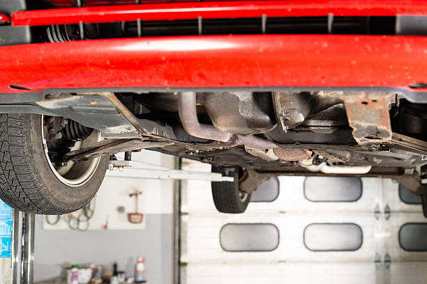 istock Car lifted up in garage 505911714