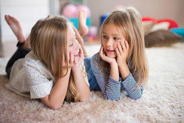 istock Girls creating new ideas on the fluffy rug 505912616