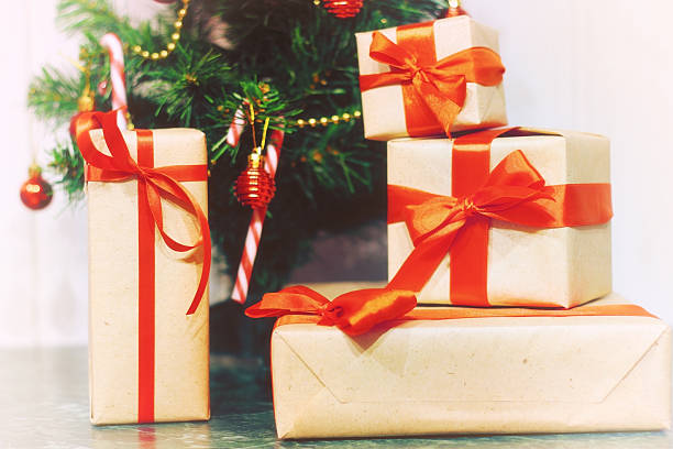 istock stack of gifts under a Christmas tree 505912796