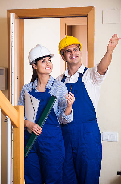 istock Professional maintenance crew of two specialists indoors 505912876