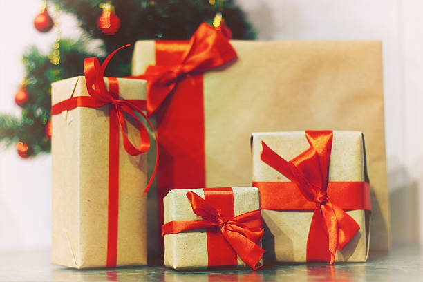 istock stack of gifts under a Christmas tree 505913424