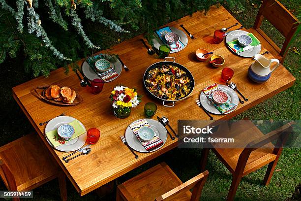 Spanish Style Dining Table With Paella Stock Photo - Download Image Now - Dining Table, Outdoors, Dinner Party