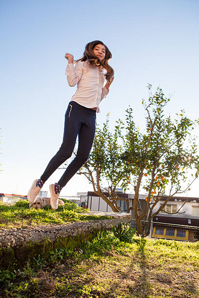 istock Girl Jumping 505916646