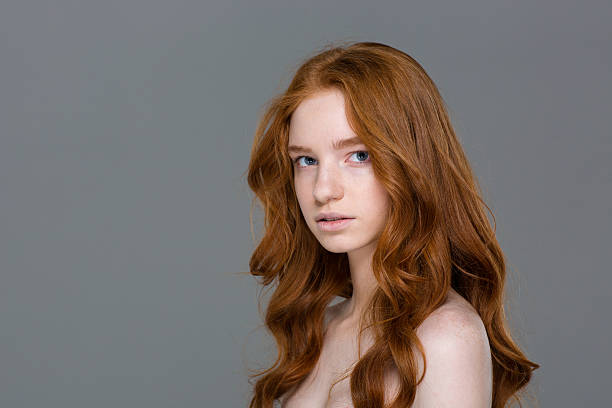 istock Young redhead woman looking at camera 505916816