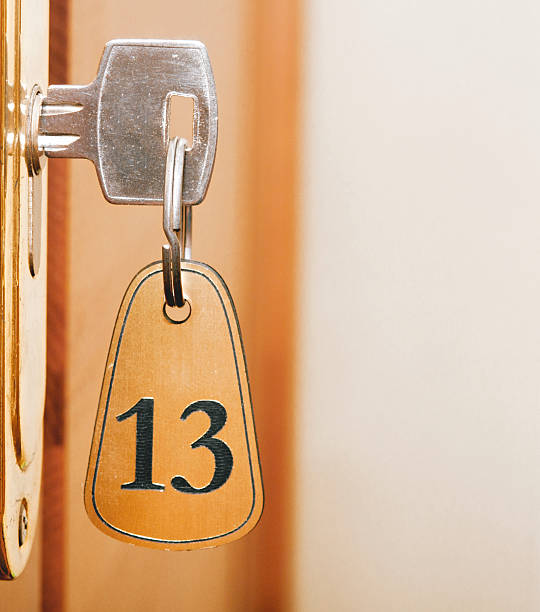 istock keyhole of room number 13 with key 505916923