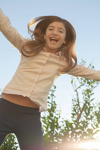 istock Girl Jumping 505916958