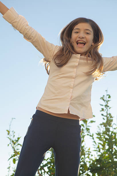 istock Girl Jumping 505917066