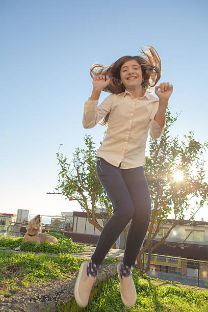 istock Girl Jumping 505917220