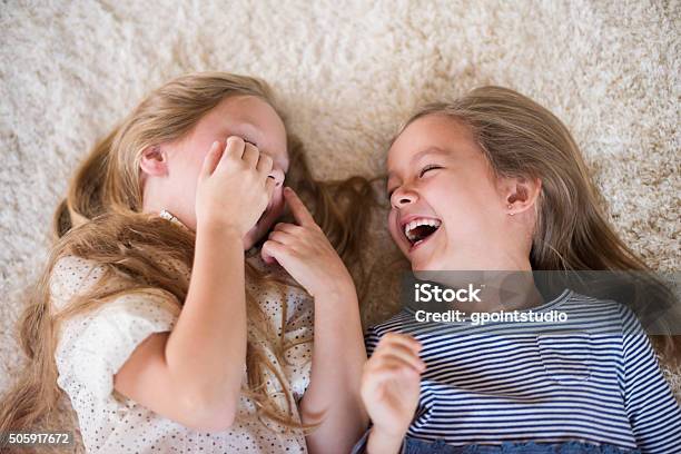 Cant Stop Laughing When They Are Together Stock Photo - Download Image Now - Child, Laughing, Carpet - Decor