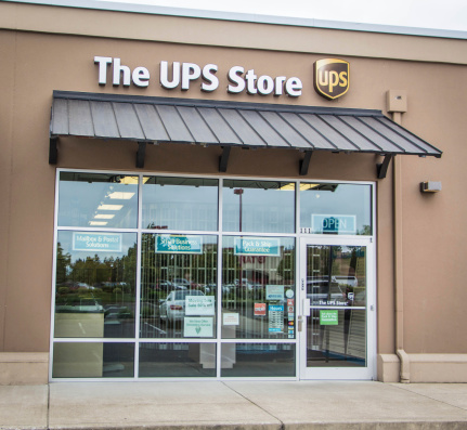 Eugene, Oregon, USA - July 20, 2014: UPS Store location in Eugene, Oregon.  UPS Store is a subsidiary of the United Parcel Service (UPS) and is a way for customers to ship packages domestically as well as worldwide.