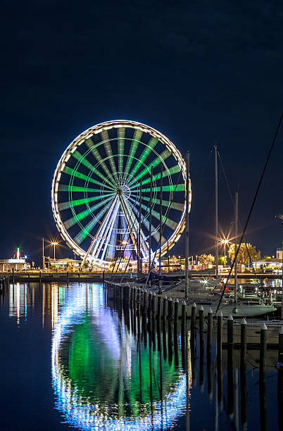 istock night view of ferris wheel from marina 505917955