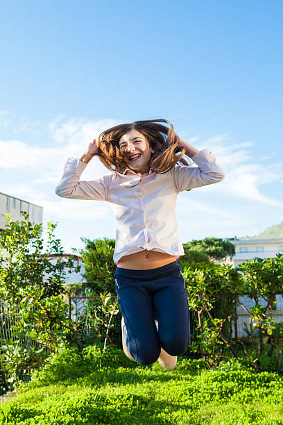 istock Girl Jumping 505918026