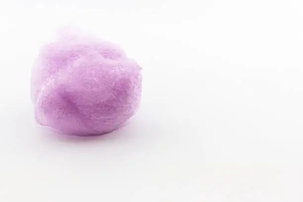 Purple spun sugar on white background, Cotton Candy.