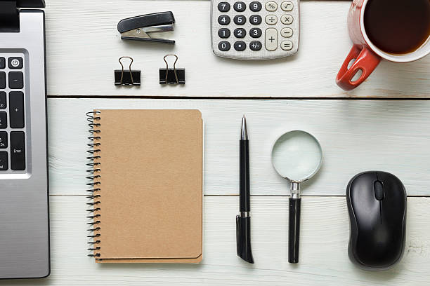 istock Office desk table with supplies and coffee cup. Top view 505920530